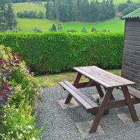 Gather round the table for a BBQ with great Welsh views