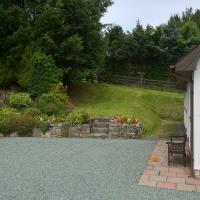 Back garden with its seating are and plenty of parking.