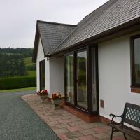 Seating at the front of the holiday letting with valley views.