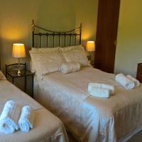 Family room with double and single beds with dual aspect windows and beautiful views.