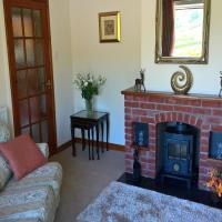 Stay warm on the cold days with the woodburner, and open the Patio doors in the summer.