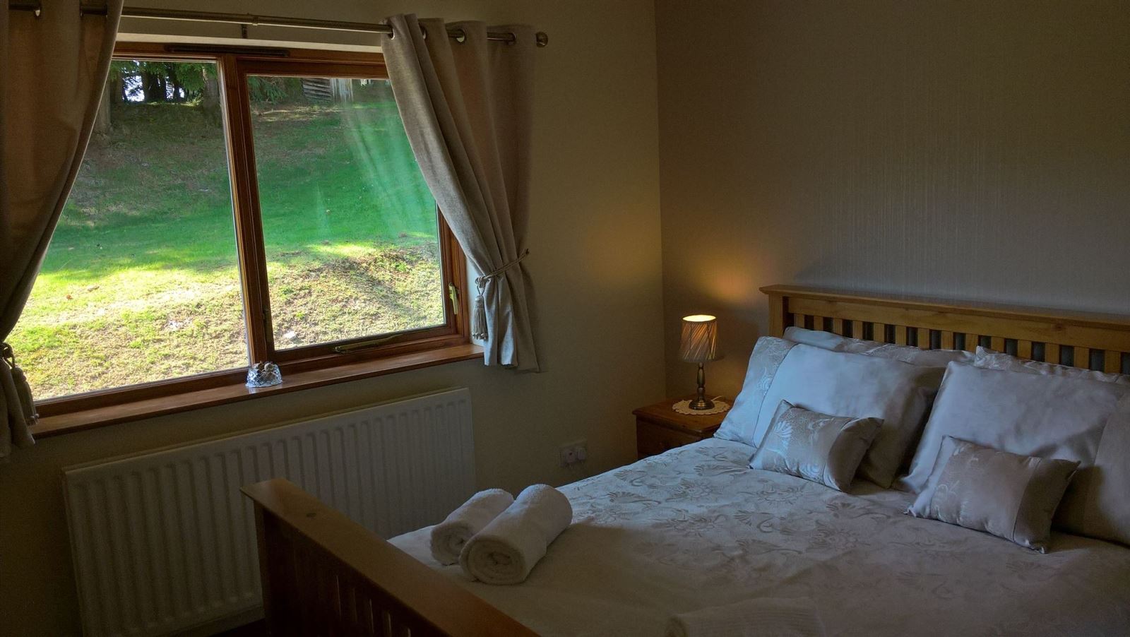 Drainbyrion Kingsize Bed in Master Bedroom with Views of the Garden and Forest